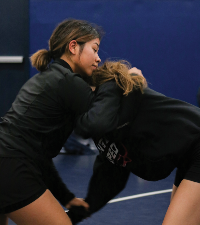 Junior Lailanie Vongnakhone having a practice match with teammate 