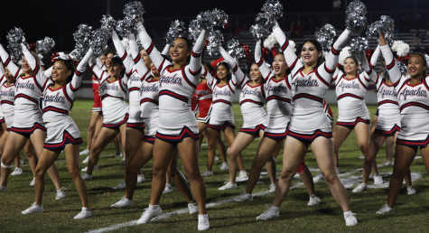 Carrillo cheering at a Sanger High School football game.