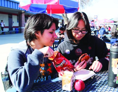 Aaralyn Vang and friend Dazzany Barcenas enjoy a school lunch in the Quad on Jan. 24.
