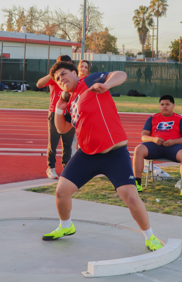 Nathan Velasquez, junior, gets ready to shoot his shot put as far as he can on March 8 at Dodson field during a track meet.