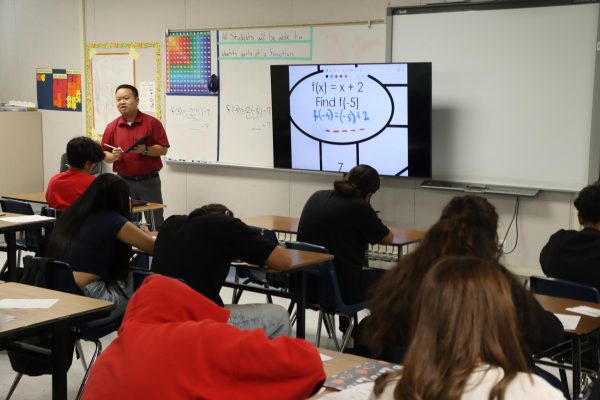 Aimee Xiong teaching students in his Integrated Math 1 during period five.