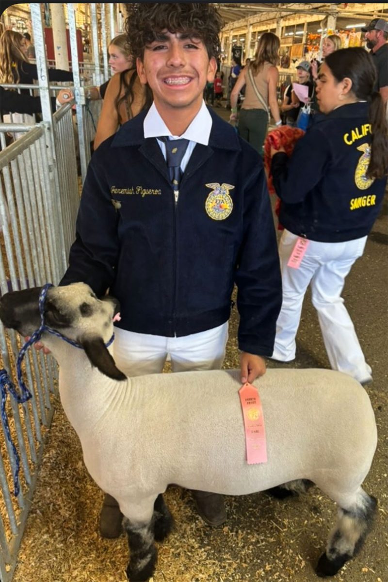 Jeremiah Figueroa posing with his goat at the Fresno  fair. 