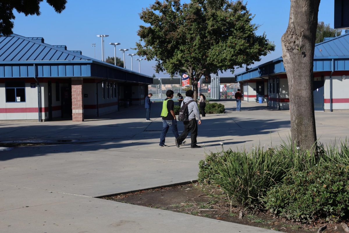 Sanger High students walking using Minga to check out. 